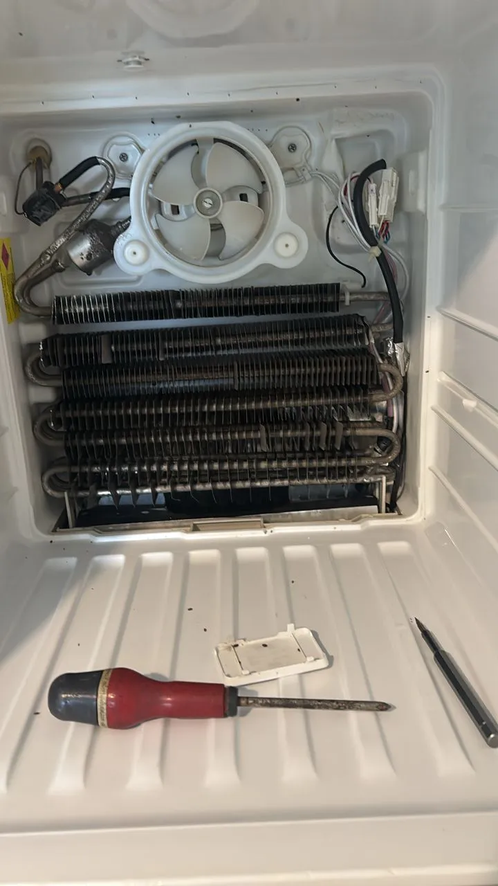 Refrigerator evaporator coil and fan repair work